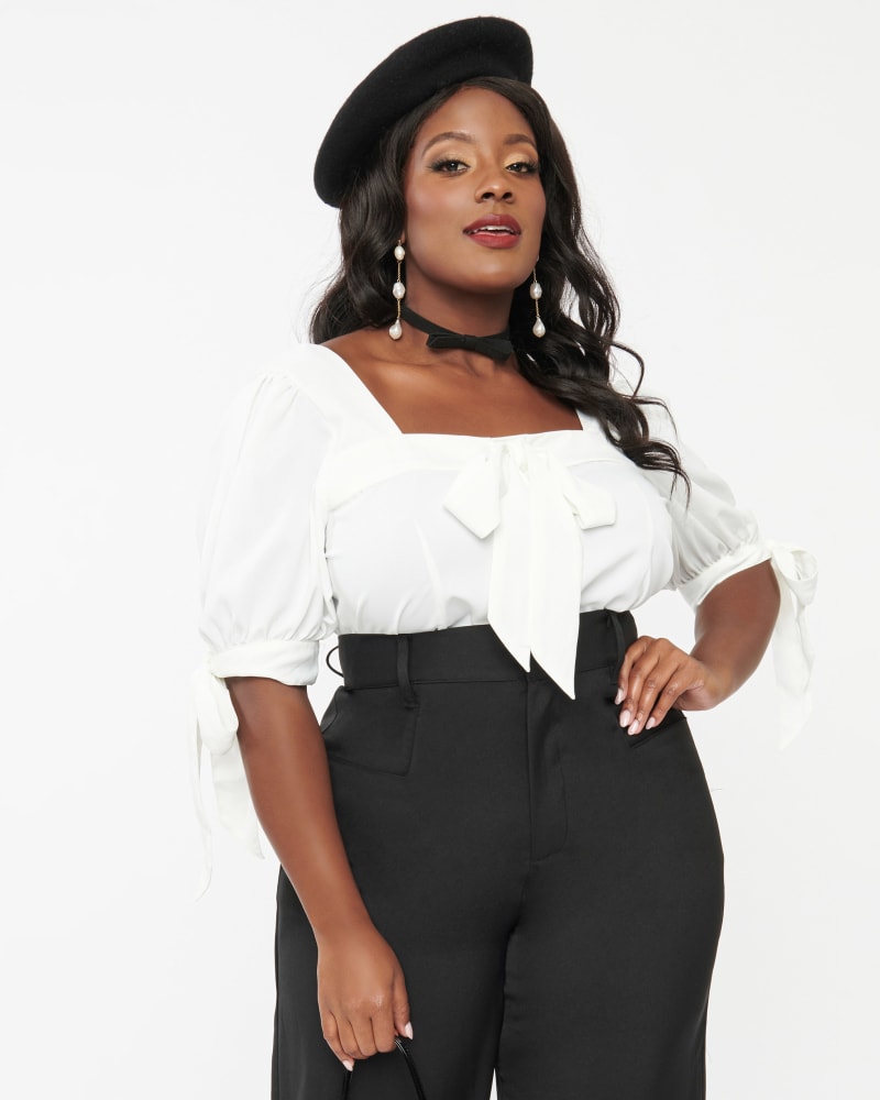 Front of a model wearing a size 5X Unique Vintage 1950s White Bow Fitted Top in White by Unique Vintage. | dia_product_style_image_id:349234